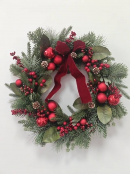 Christmas Wreath with Pine Needles, Magnolia Leaves, Red Baubles and Red Velvet Bow